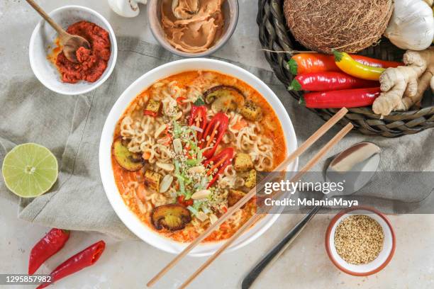 asian mie noodle soup with tofu, peanut, lime and chili as flat lay - cuisine thai stock pictures, royalty-free photos & images