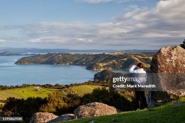 girl at stony batter historic reserve on waiheke island - waiheke island stock pictures, royalty-free photos & images