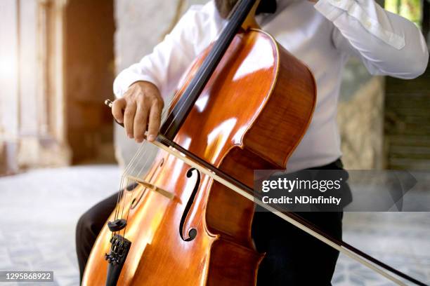 classical music player exercise solo performance stock photo - cello stock pictures, royalty-free photos & images