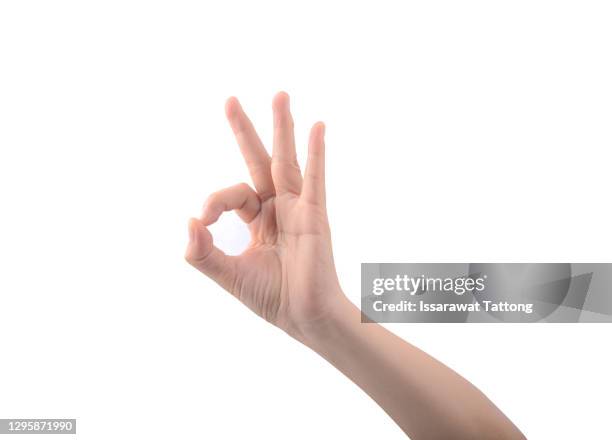 womans hand ok sign on white background. - geste de la main photos et images de collection