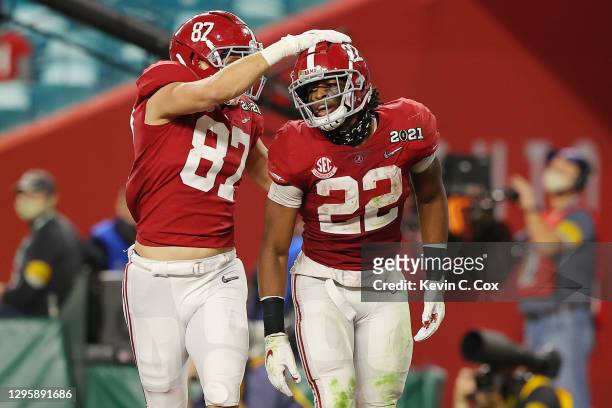 Miller Forristall celebrates with Najee Harris of the Alabama Crimson Tide during the second quarter of the College Football Playoff National...