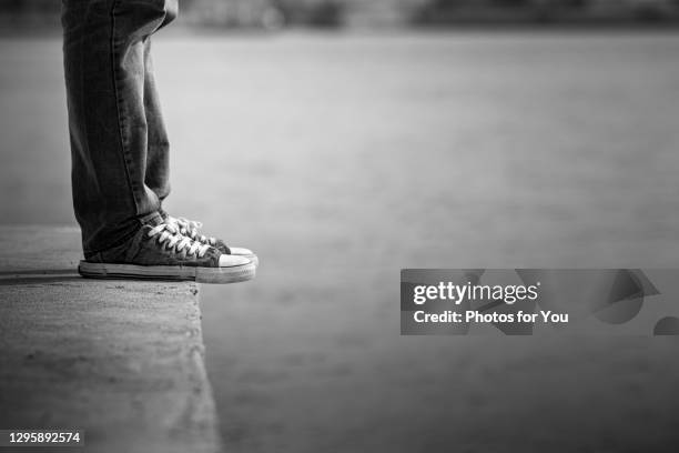 men affected by covid-19 or the coronavirus, unemployment, sickness, no money, depression, everything leaves him alone. - suicidio fotografías e imágenes de stock