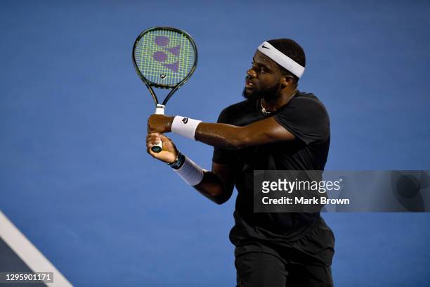 Frances Tiafoe of the United States returns the shot against Cameron Norrie of Great Britain during the Quarterfinals of the Delray Beach Open by...