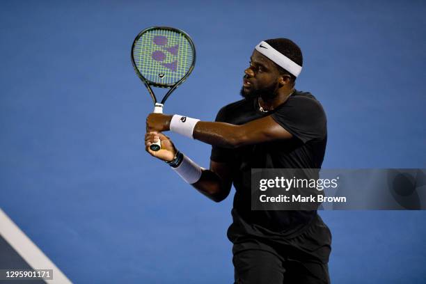 Frances Tiafoe of the United States returns the shot against Cameron Norrie of Great Britain during the Quarterfinals of the Delray Beach Open by...