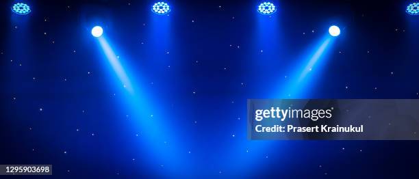 luminous rays from concert lighting against a dark background, musical instrument concept - concert lights stock pictures, royalty-free photos & images