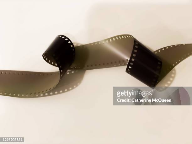 roll of unprocessed camera film - vinyl film stock pictures, royalty-free photos & images