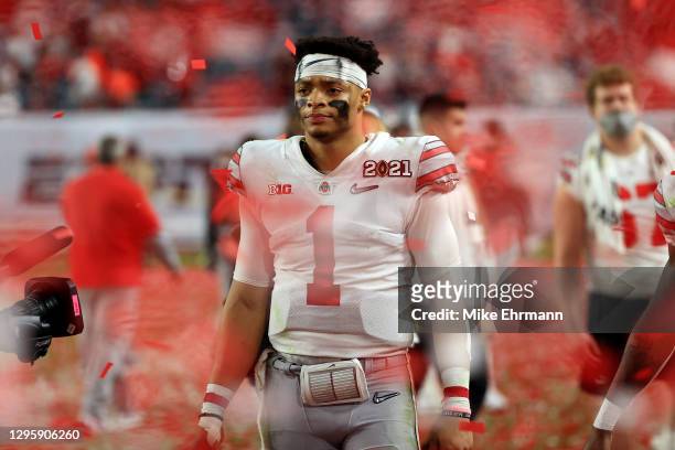 Justin Fields of the Ohio State Buckeyes leaves the field following the College Football Playoff National Championship game against the Alabama...