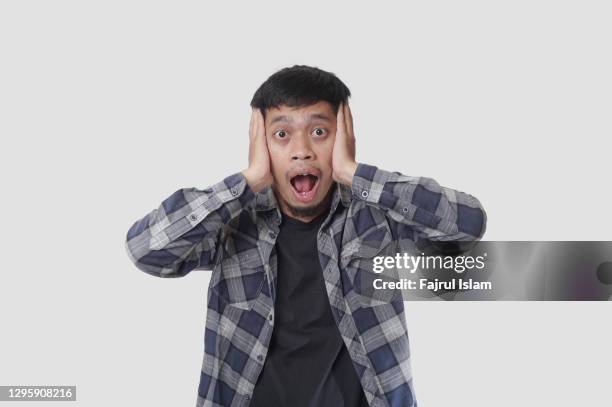 asian man with hands on face feeling surprised face - excitement emoji stock pictures, royalty-free photos & images