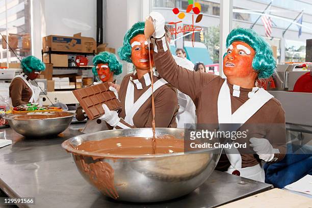 Oompa Loompas hands out Golden Tickets for the "40th Anniversary of Willy Wonka & The Chocolate Factory" event on October 18, 2011 in New York City.