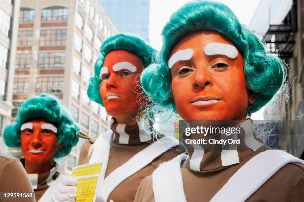 Oompa Loompas hands out Golden Tickets for the "40th Anniversary of Willy Wonka & The Chocolate Factory" event on October 18, 2011 in New York City.