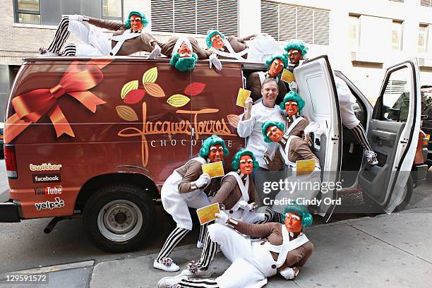 Oompa Loompas pose with Chef Jacques Torres as they hand out Golden Tickets for the "40th Anniversary of Willy Wonka & The Chocolate Factory" event...