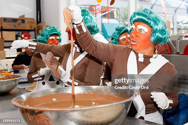 Oompa Loompas hands out Golden Tickets for the "40th Anniversary of Willy Wonka & The Chocolate Factory" event on October 18, 2011 in New York City.