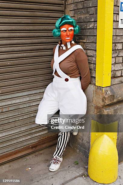 Oompa Loompas hand out Golden Tickets for the "40th Anniversary of Willy Wonka & The Chocolate Factory" event on October 18, 2011 in New York City.