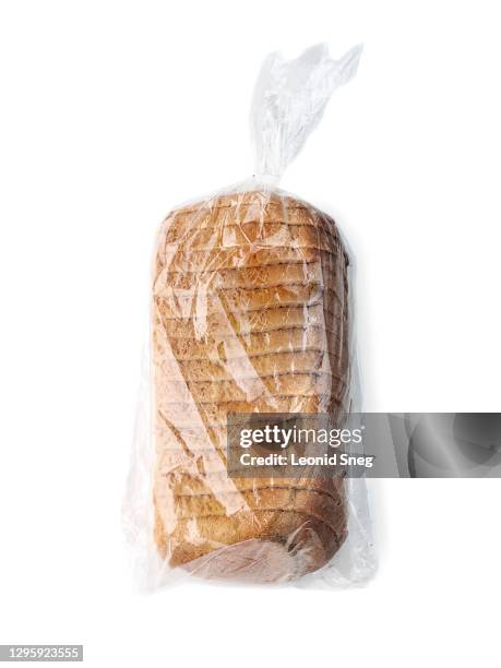 food photography of loaf of bread in clean transparent plastic pack side view close-up on a white background isolated - loaf of bread ストックフォトと画像