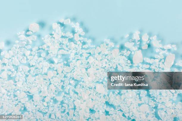 sea salt seasoning on trendy pastel blue background. bath salt for scrubbing and cleansing skin. exfoliation scrubber. cosmetic products for skin care. - bath salt ストックフォトと画像