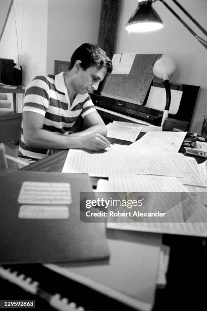 Pulitzer Prize winning classical music composer John Corigliano works on a score in his residence at Atlantic Center for the Arts in New Smyrna...