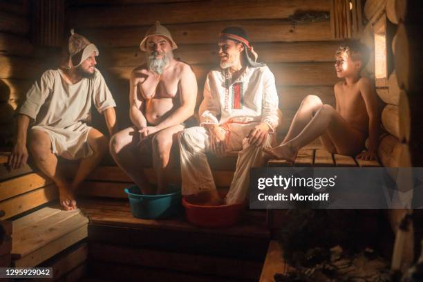 group of male persons are taking a steam bath - banya stock pictures, royalty-free photos & images