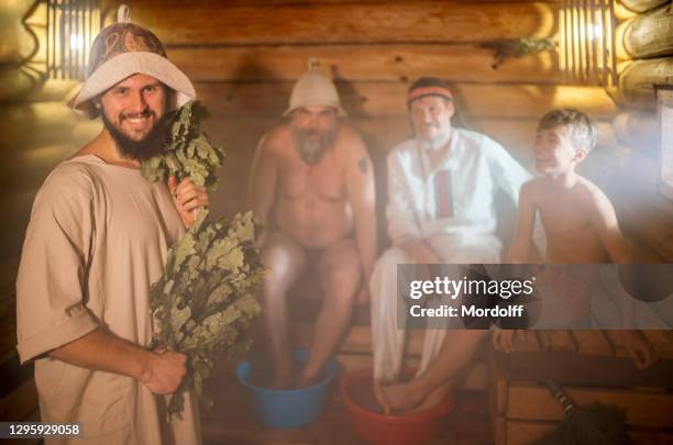 family rest and relax at sauna. russian customs and traditions - banya stock pictures, royalty-free photos & images