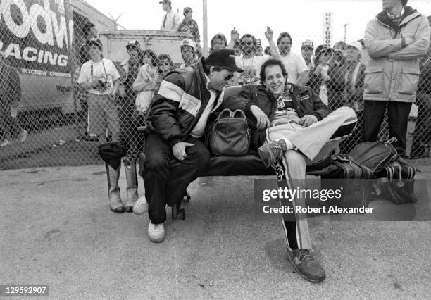 Richard Childress, left, owner of the Goodwrench NASCAR race car driven by Dale Earnhardt Sr., relaxes with his team's crew chief, Kirk Shelmerdine,...