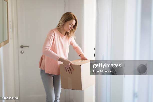 Boxed Getting Up 251 Woman Lifting Heavy Box Stock Photos, High-Res Pictures, and Images ...
