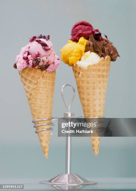 ice cream and sherbet with toppings in waffle cones - gelato stock pictures, royalty-free photos & images