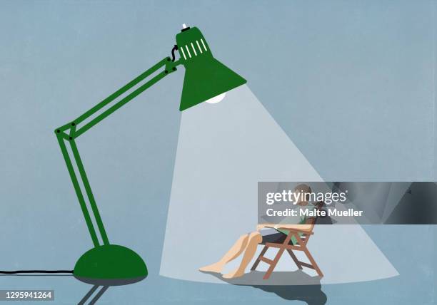 ilustrações, clipart, desenhos animados e ícones de man sitting under bright sun lamp - alternative therapy