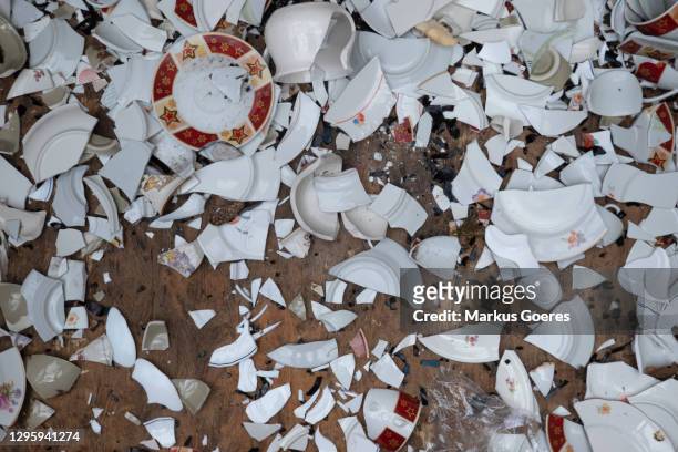 broken dishes scattered on floor - smashed crockery stock pictures, royalty-free photos & images