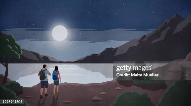 bildbanksillustrationer, clip art samt tecknat material och ikoner med bright full moon over couple hiking at tranquil mountain lake - woman outside