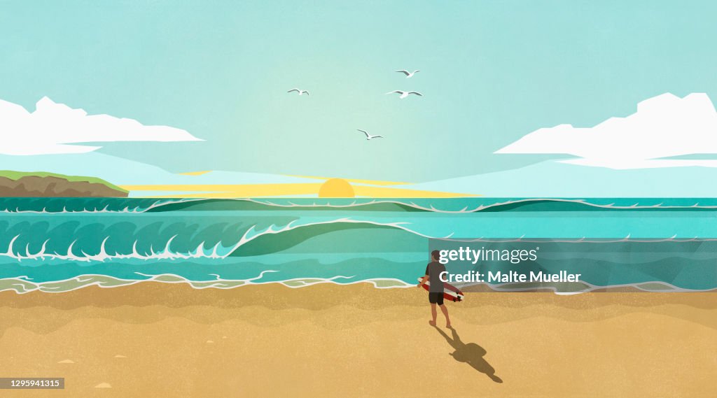 Man with surfboard watching waves on sunny idyllic summer beach