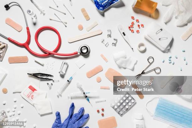 variety of medical supplies on white background - apparecchiatura medica foto e immagini stock