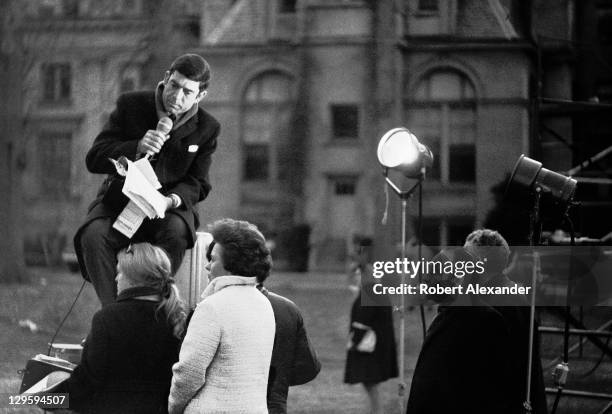 Television newsman Dan Rather broadcasts from outside the National Cathedral in Washington, D.C., during the funeral for former president Dwight...