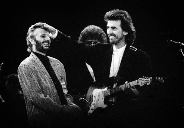 Ringo Starr and George Harrison perform during a concert for the Princes Trust, attended by Princess Diana and Prince Charles, at Wembley Stadium,...