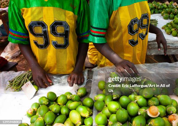 Women with the same sport shirt selling fresh betel nuts in a market, Autonomous Region of Bougainville, Bougainville, Papua New Guinea on October 9,...
