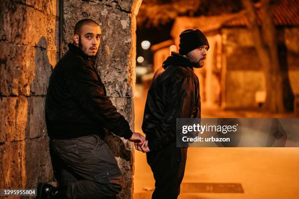 man buying drugs on the street - deadly exchange stock pictures, royalty-free photos & images