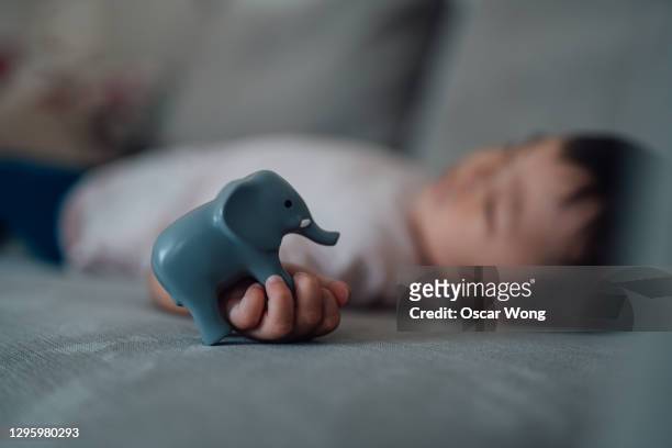 little girl dreaming about her future - elephant at home stockfoto's en -beelden