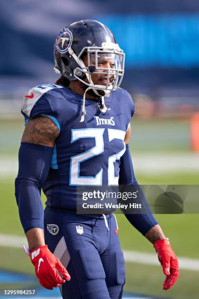 Running back Derrick Henry of the Tennessee Titans warms up before their AFC Wild Card Playoff game against the Baltimore Ravens at Nissan Stadium on...