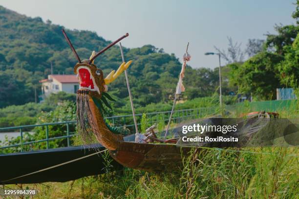 old abandoned dragon-headed fishing boat in tai o village - dragon headed stock pictures, royalty-free photos & images