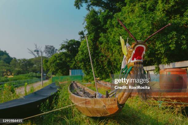 old abandoned dragon-headed fishing boat in tai o village - dragon headed stock pictures, royalty-free photos & images