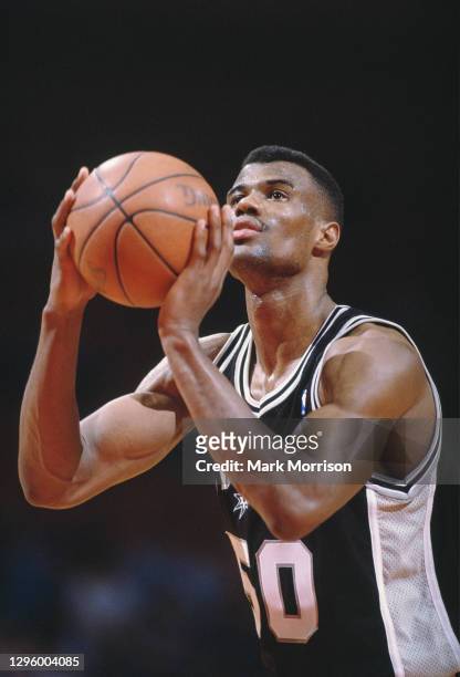 David Robinson, Center for the San Antonio Spurs prepares to shoot a free throw during the NBA Midwest Division basketball game against the Houston...