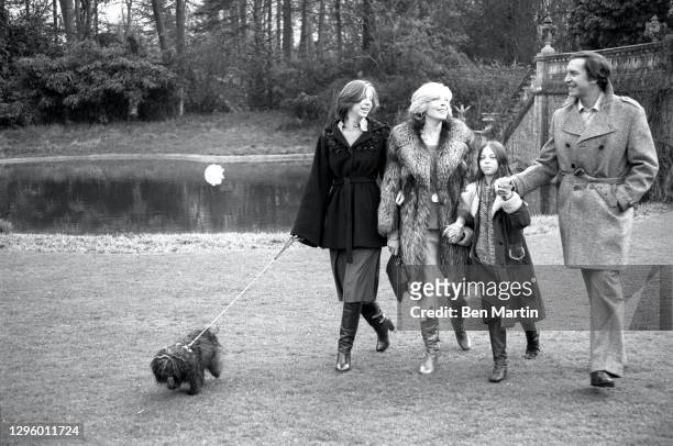 Barbara Bain and Martin Landau with daughters Susan and Juliet walking in London, June 1976.