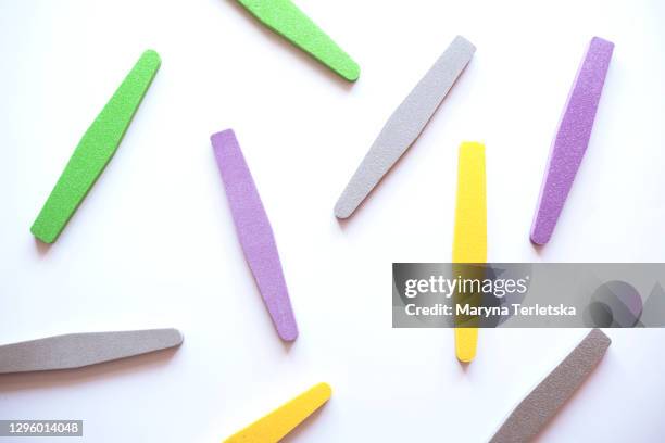 many nail files on a white background. - nail file stock pictures, royalty-free photos & images