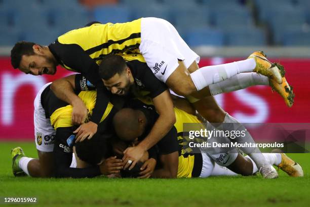 Danilho Doekhi of Vitesse Arnhem celebrates scoring his teams first goal of the game with team mates during the Dutch Eredivisie match between...