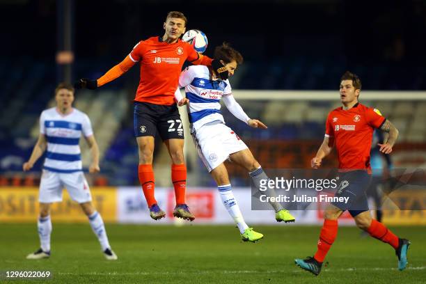 Kiernan Dewsbury-Hall of Luton Town battles for possession with Tom Carroll of Queens Park Rangers during the Sky Bet Championship match between...