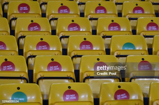 Detailed view of a seat with the message "Sit Here" which is part of a COVID-19 precaution prior to the Premier League match between Wolverhampton...