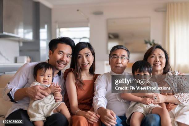 big multi generational family at home - heritage month stock pictures, royalty-free photos & images