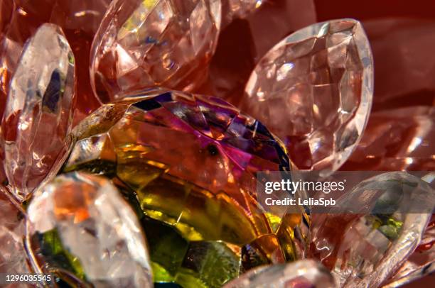 crystal flower on a red background, close-up photo - diamant bijoux stock pictures, royalty-free photos & images