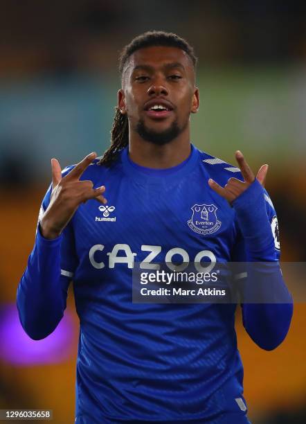 Alex Iwobi of Everton celebrates after scoring his team's first goal during the Premier League match between Wolverhampton Wanderers and Everton at...