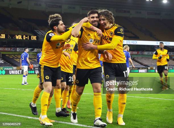 Ruben Neves of Wolverhampton Wanderers celebrates with team mate Fabio Silva after scoring their team's first goal during the Premier League match...