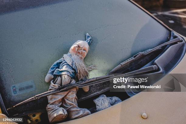 old doll under windshield wiper - cracked windshield stock pictures, royalty-free photos & images