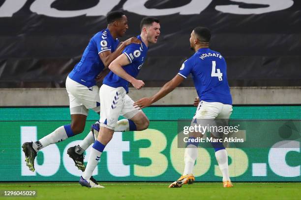 Michael Keane of Everton celebrates with teammates Yerry Mina and Mason Holgate after scoring his team's second goal during the Premier League match...